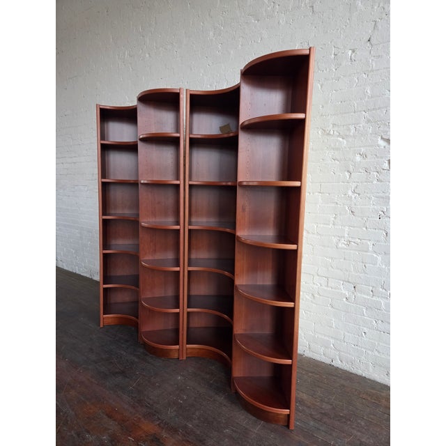 Danish modular shelving unit with adjustable shelves, circa 1980s. Includes 4 pieces with 2 concave & 2 convex corner...