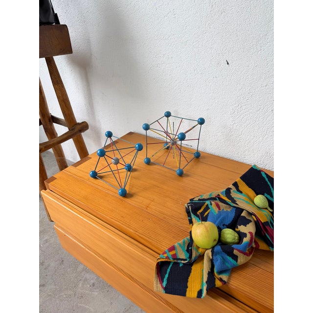 Set of two vintage molecular models from the 1960s/70s. we love their patina, their graphic design, and their decorative...