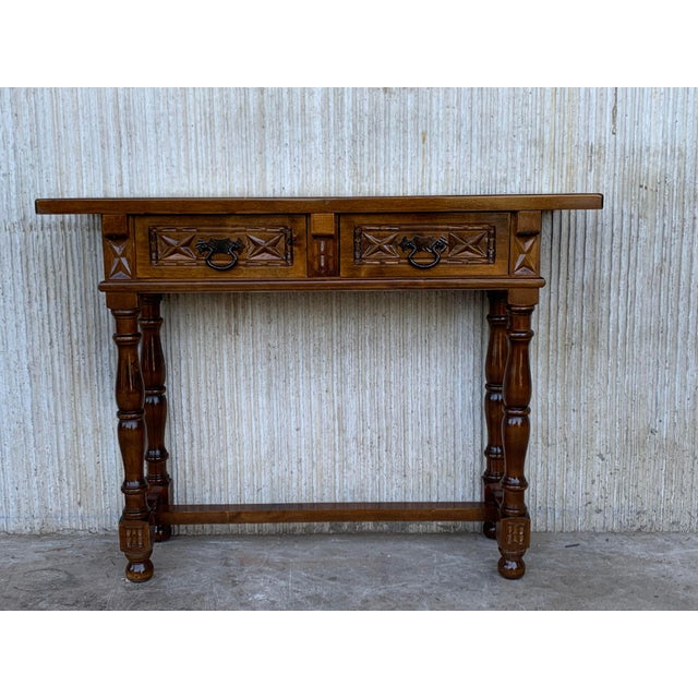 This characterful table is of rare narrow depth of 15in. It is characteristic of Spanish Baroque furniture with a thick...