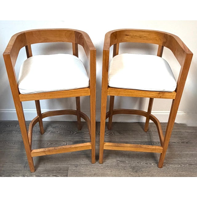 Pair of Architectural Solid Teak Bar Stools Attributed to Palecek, Organic Modern This pair of architectural solid teak...
