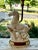 A striking vintage porcelain horse sculpture table lamp featuring a beautifully modeled leaping horse poised above a...