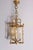 This exquisite 20th-century French lantern showcases timeless elegance and refined craftsmanship. Its gilded metal frame,...