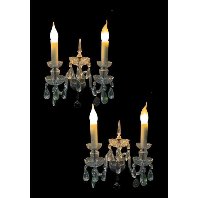 This elegant pair of bohemian crystal wall sconces combines traditional craftsmanship with refined decorative appeal. Each...