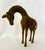 A charming vintage brass giraffe sculpture by Leonard Silver Manufacturing Group, circa 1970s. This wonderfully stylized...