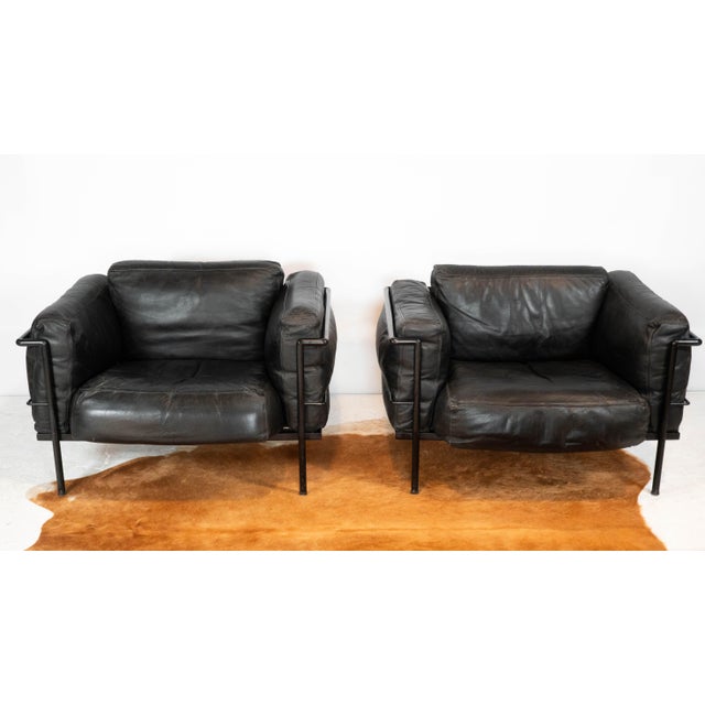 Pair of Le Corbusier for Cassina attributed LC3 Grand Modele lounge chairs, circa 1980s. Blacked out color palette , thick...