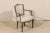An single Italian, early 19th century accent armchair with richly carved wood details. This Italian accent chair has a...