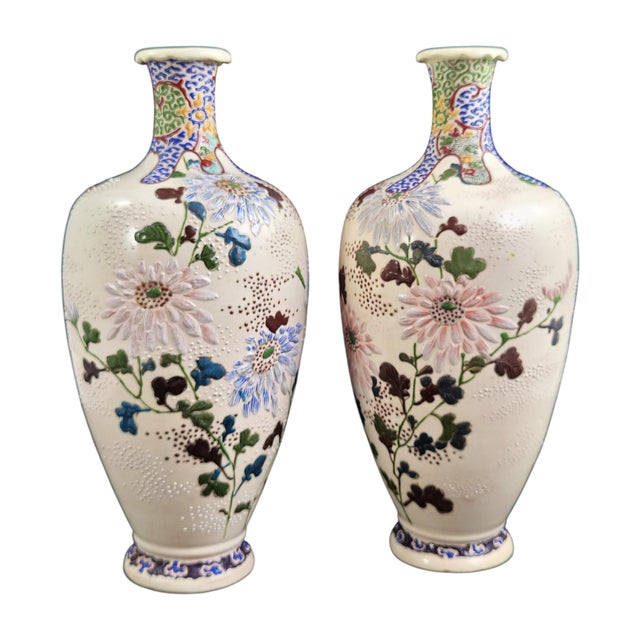 A pair of Meiji-period Japanese Satsuma earthenware vases from Kyoto, circa 1890. They are made in the Kinkōzan tradition...