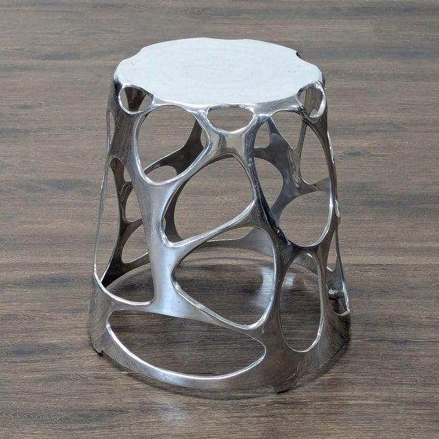 Polished aluminum. Brand: Umbra. Original Price: $294. Dimensions (in): 18W x 18D x 18H.