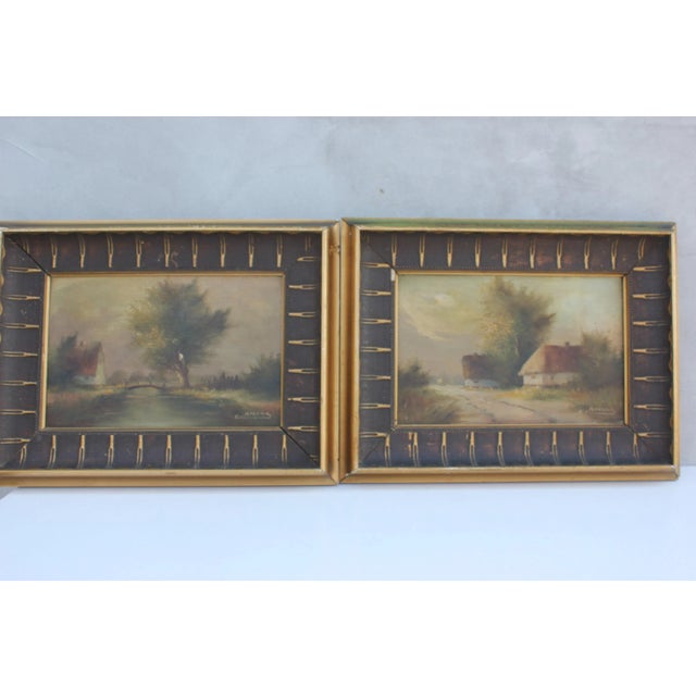 Vintage framed oil landscapes. The colors are dark, in green-brown range, framed with interesting wooden frames in brown...