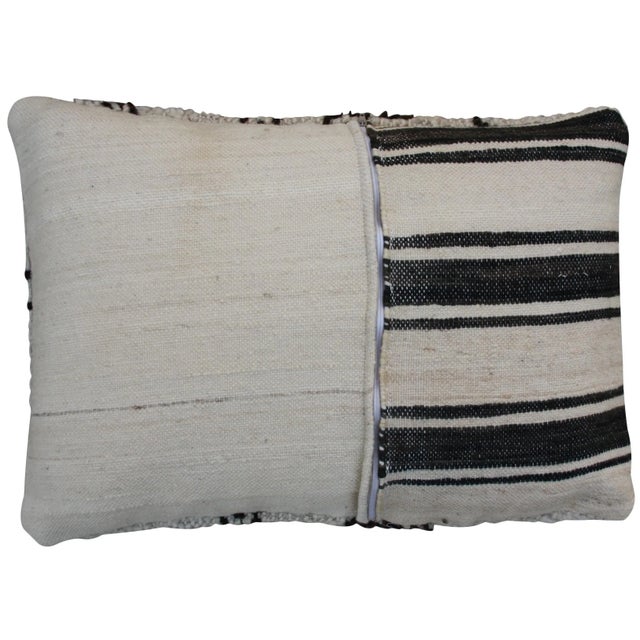 Moroccan Beni Ourain pillow from the High Atlas Mountains. Handloomed of soft organic wool with a harlequin pattern....
