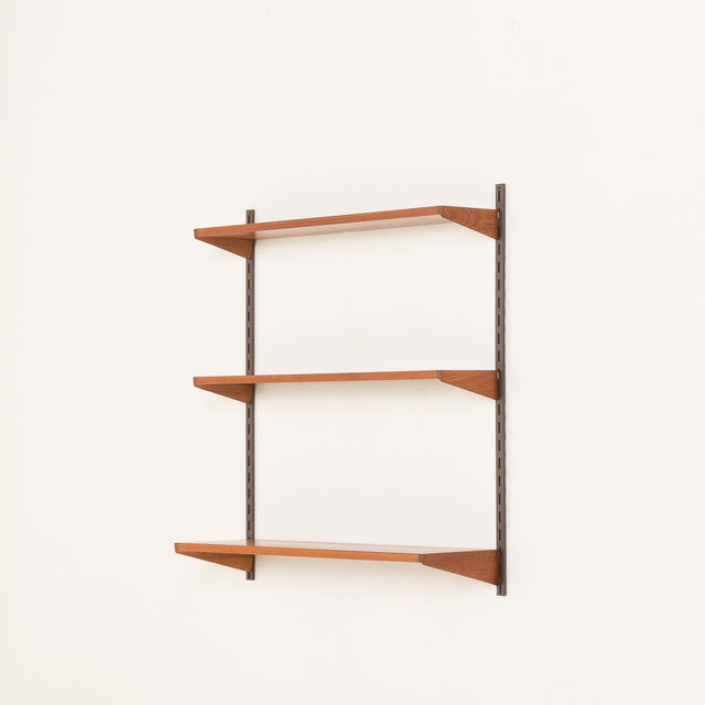 This minimalist and functional mid-century shelving unit, designed by Kai Kristiansen, an icon of Danish design, was made...