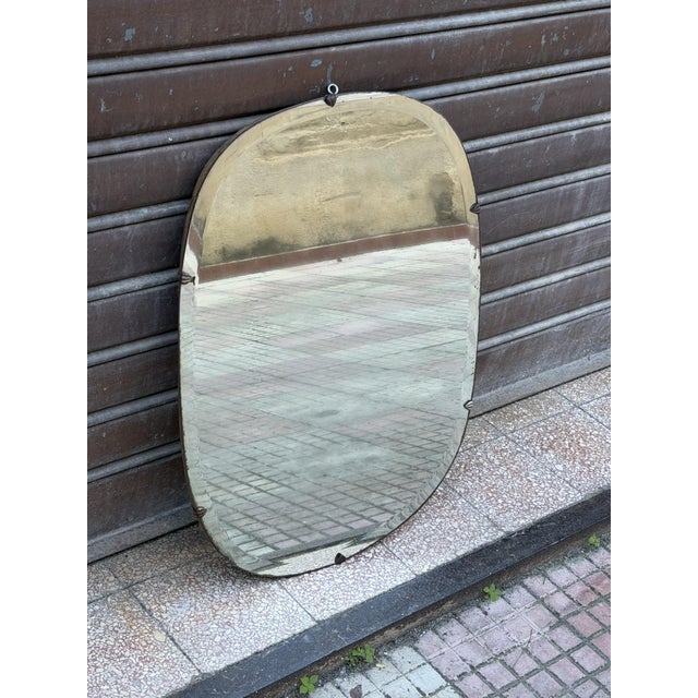 Wall mirror with metal inserts, Italy, 1940s Small flaws and imperfections attest to its authenticity. Fair condition....