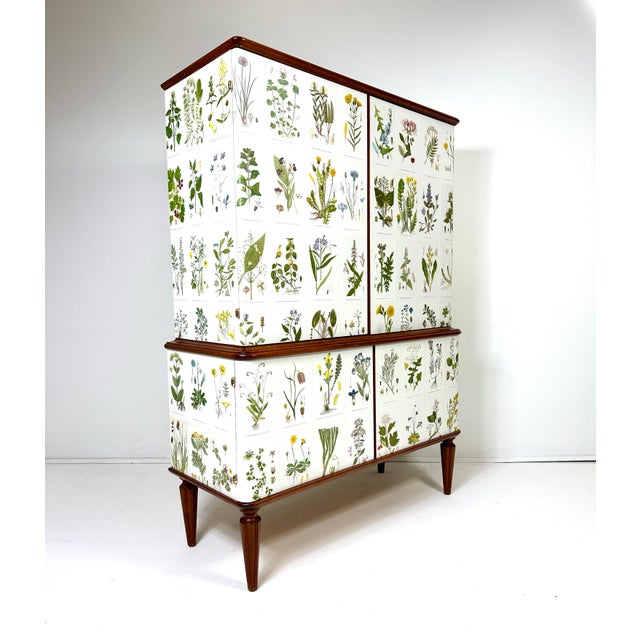 1950’s Swedish Cabinet later papered with illustrations by C.A. Lindman book Nordens Flora. Cabinet consists of four doors...