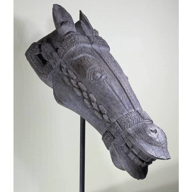 This exquisite antique hand-carved wooden horse head sculpture is a stunning piece of Indian art. Horses symbolize power,...