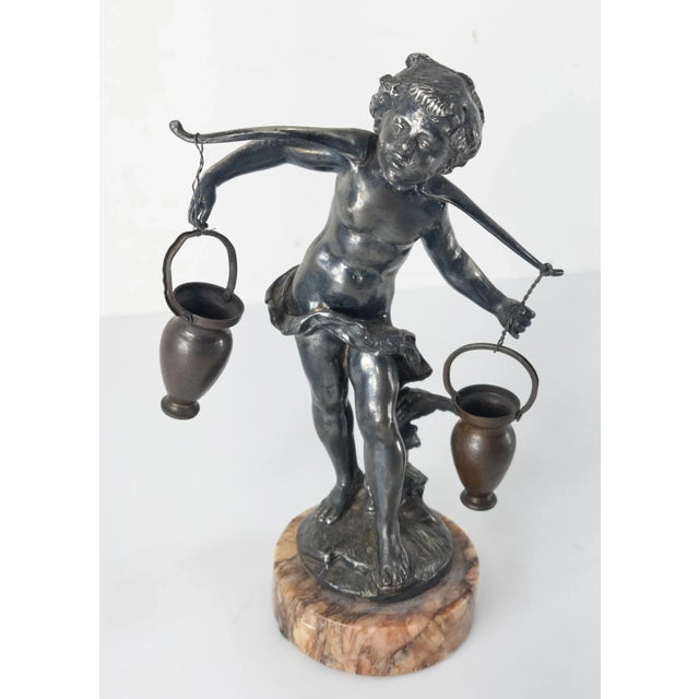 We are selling this small silvered figure. This bronze looking figure appears to be a hollow-cast white metal with...