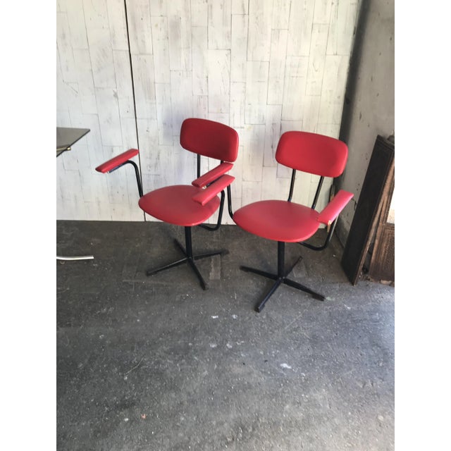 - Hungarian retro swivel chairs - Red leatherette seat and back - Metal black base