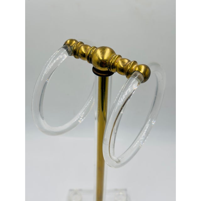 Make a statement in a powder room, primary bath or even next to the kitchen sink. Brass & lucite.