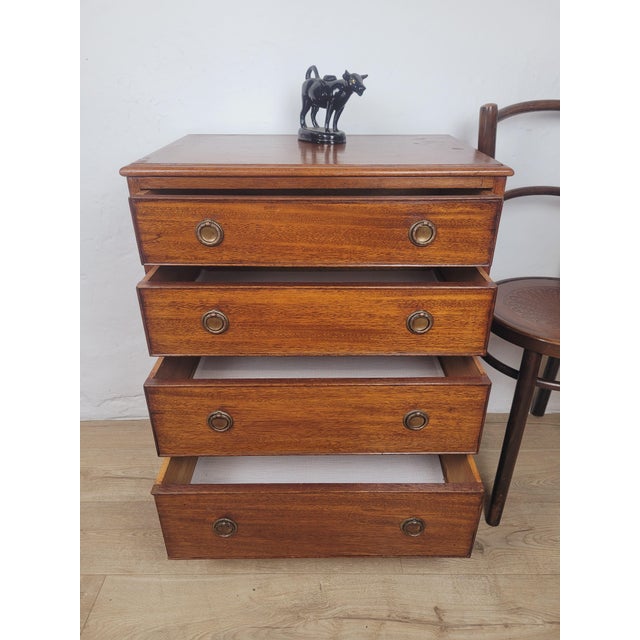 This is a gorgeous mid 20th century chest of drawers, displaying a rich mahogany patination to the front that is sure to...