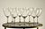 A set of eight French crystal red wine glasses by Baccarat, each signed on the underside of the foot with the acid-etched...