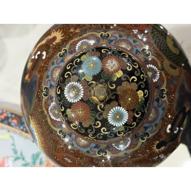 An exceptional and richly decorated Japanese cloisonne enamel covered jar from the Meiji period, circa 1895, distinguished...