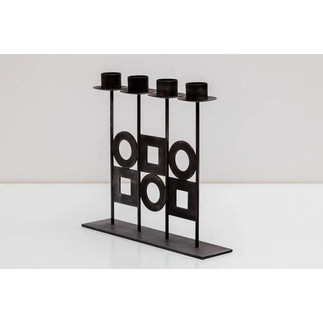 Vintage modernist candelabra, 1960s. Geometric iron and metal work. Holds 4 candles. Dimensions: 26W x 23H x 6D cm....