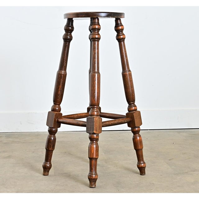 English late 19th century pedestal-stool that becomes a versatile piece of accent furniture anywhere in the home. The...