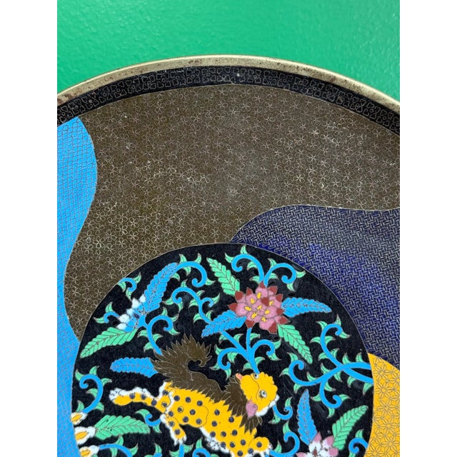 Japan, Meiji Period, Circa 1880 Diameter: 12 inches This striking and highly unusual Japanese cloisonne charger represents...