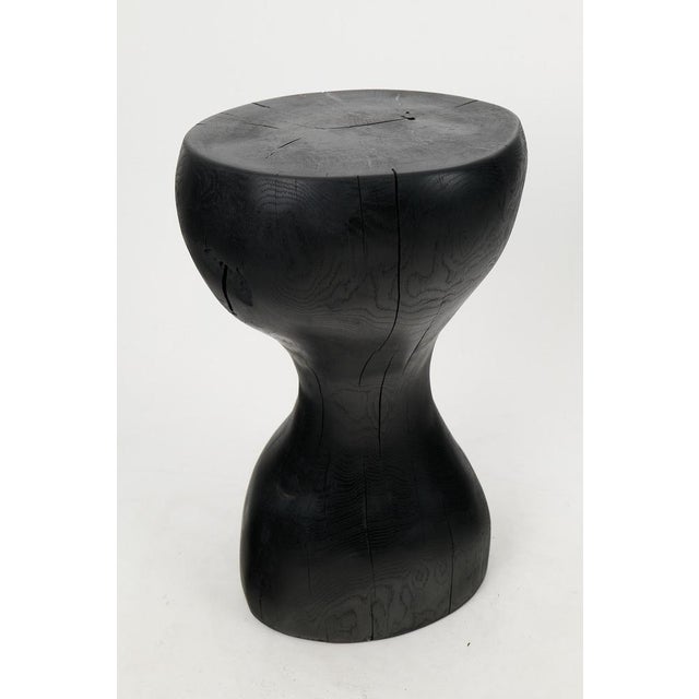 Chainsaw carved side table. Carved from a single piece of burnt wood and protected with the highest quality oils, ensuring...