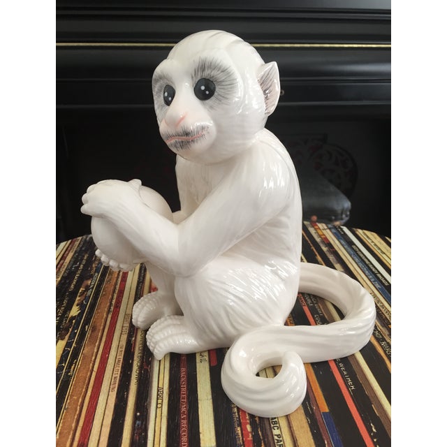This white Capuchin ceramic/porcelain monkey is especially notable because one similar to it is prominently displayed in...