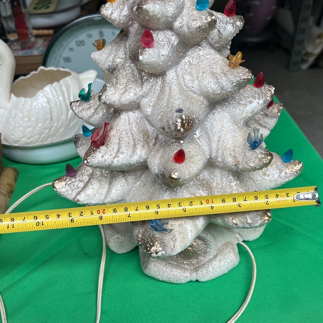 Up for consideration is a beautiful vintage 1970s white light-up Christmas tree with bird accents and a wind up music box...