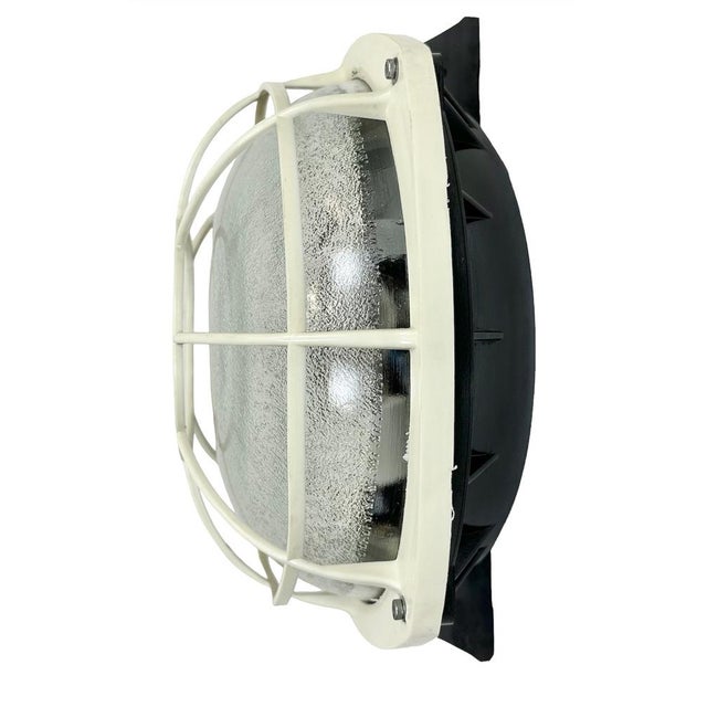 Vintage industrial bakelite wall lamp made by Elektrosvit in former Czechoslovakia during the 1980s. It features a...