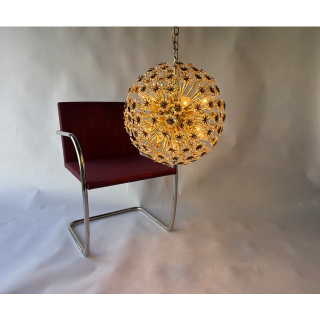 Large Chandelier from the 1950s. The chandelier has eleven sockets for candelabra bulbs, 150 arms with each holding eight...