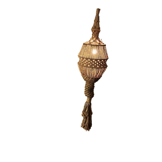 Make a dramatic bohemian statement with this monumental vintage macramé hanging swag lamp measuring an impressive 5 feet 3...