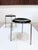 Iconic pair of stools, model 3170 by Arne Jacobsen for Fritz Hansen from the 1960s, with three metal legs and a black-...