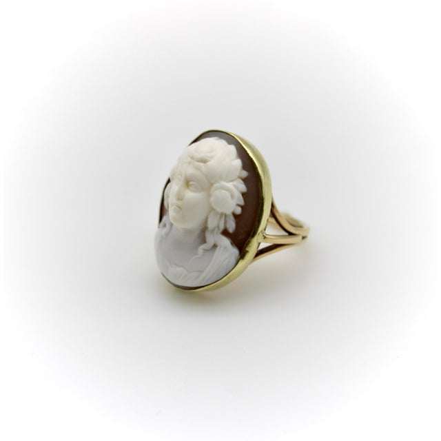 This 14k gold ring features an exquisitely carved shell cameo in a very high relief. Circa the Victorian era, it was...