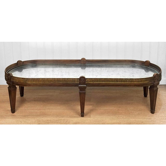 A 1960's Neoclassical Louis XV Surtout De Oval Table Mfg by Baker Furniture Monumental Sized, 64" wide Solid Mahogany...