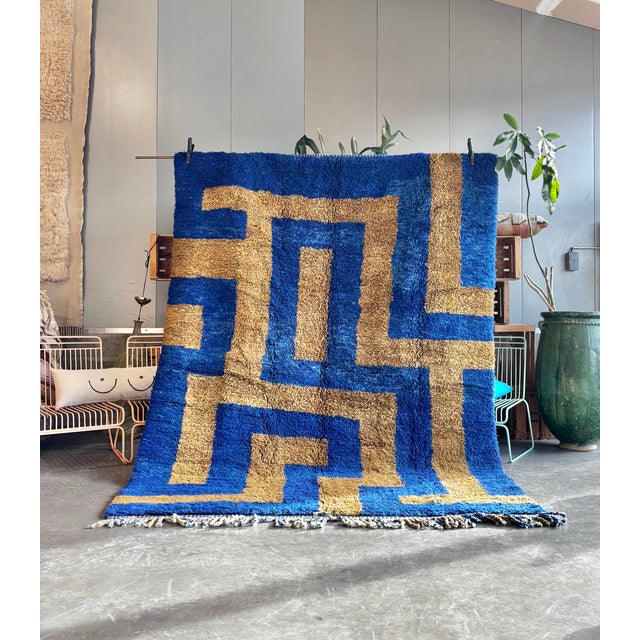 This Moroccan Mrirt Beni Ouarain rug is a handwoven piece crafted by skilled artisans from the Middle Atlas region of...