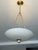 Elevate your space with this elegant matte cream pendant light featuring a timeless brushed brass finish and a softly...