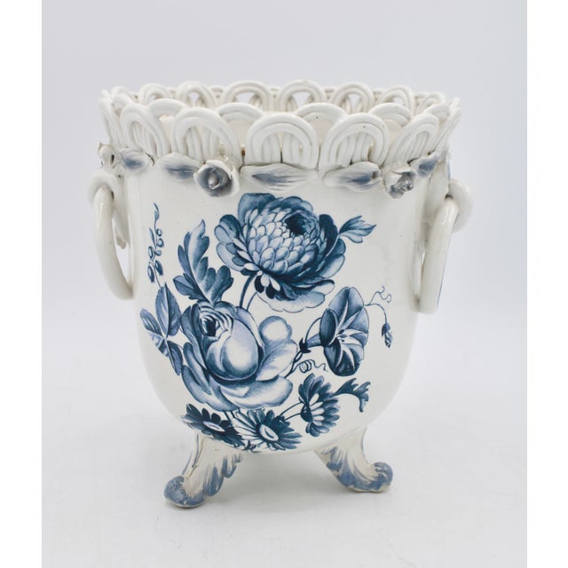 A charming vintage ceramic blue and white floral planter, circa 1950s. This is a lovely planter with ornate detail. 6.25...