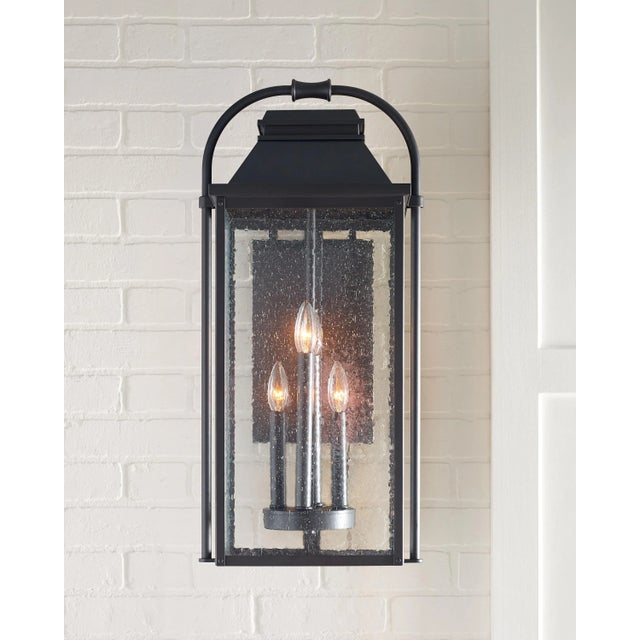 The Sean Lavin Wellsworth four light outdoor wall fixture in antique bronze enhances the beauty of your property, makes...