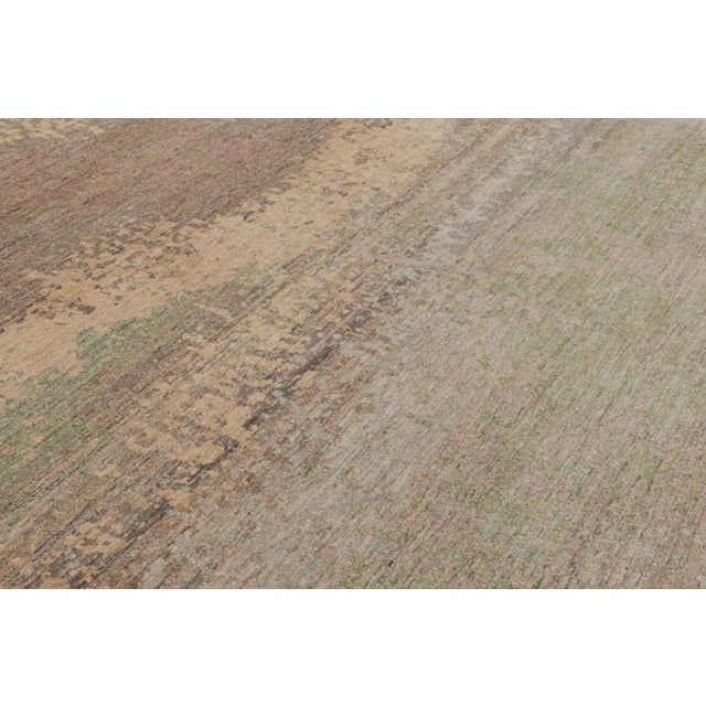 Hand-knotted in silk, this 9x12 abstract rug from Rug & Kilim’s Modern Collection is also an inventive take on textural...