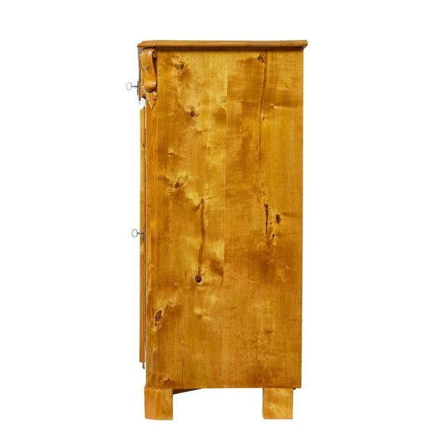 scandinavian tiger birch highboard circa 1870. fine quality piece of swedish cabinet making, showcasing the use of a cut...