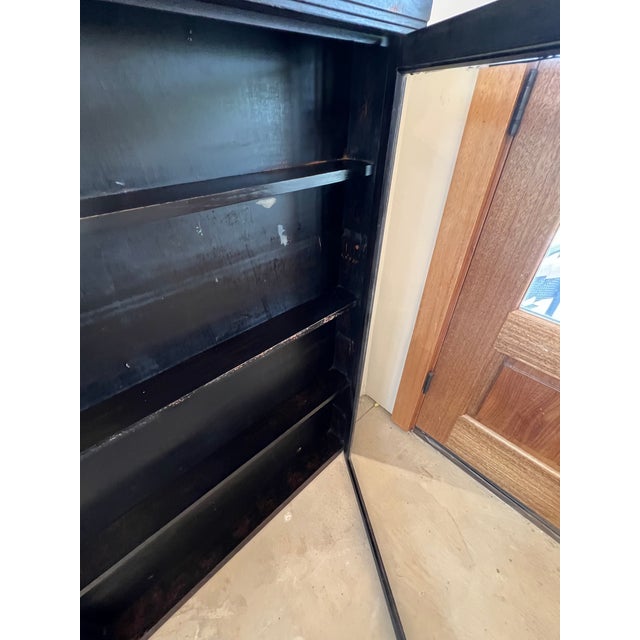 Add rustic charm and practical storage to your space with this country store-style wall hanging display cabinet. With its...