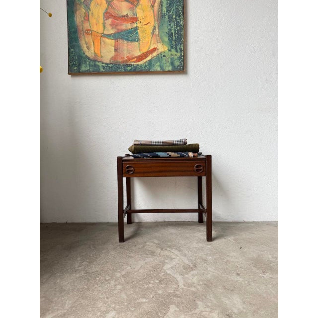 Mahogany bedside table by jacques hauville for roche bobois in the 1950s. with its understated and elegant style, this...