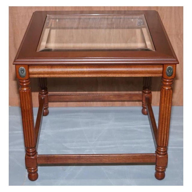 Regency style pair of end tables with glass tops. A very well-made and lovely set to add to your home. Average age-related...