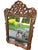 A vintage French Rococo-style mirror, meticulously hand-carved from wood. The frame likely features intricate and ornate...