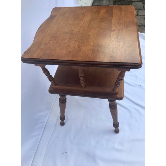 This vintage two-tiered maple side table is a beautiful addition to any home. With a height of 24.5 inches, length of 16.5...