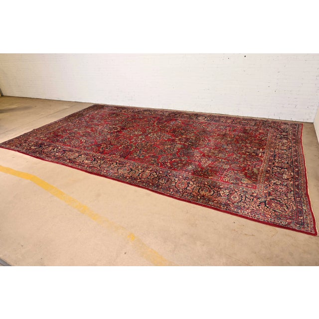 A gorgeous antique Persian Sarouk large room size rug Circa 1930s Features beautiful traditional floral sprays and...