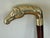 Handsome, Chinoiserie figural horse head walking cane in solid brass with wooden shaft. Disassembles into three pieces....