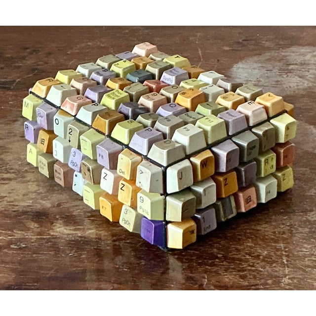 Discover a unique piece of functional art with this charming vintage trinket box, meticulously crafted from repurposed...